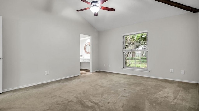 unfurnished room featuring vaulted ceiling, carpet, a ceiling fan, and baseboards