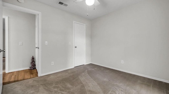 unfurnished bedroom with carpet, baseboards, and ceiling fan