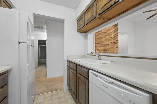 2000 Willoughby Ln Unit 5520, Arlington, TX 76011 - kitchen with white appliances, a sink, light countertops, light carpet, and ceiling fan