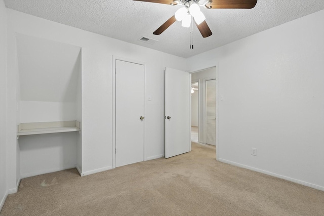 2000 Willoughby Ln Unit 5520, Arlington, TX 76011 - unfurnished bedroom with carpet flooring, a textured ceiling, baseboards, and a ceiling fan