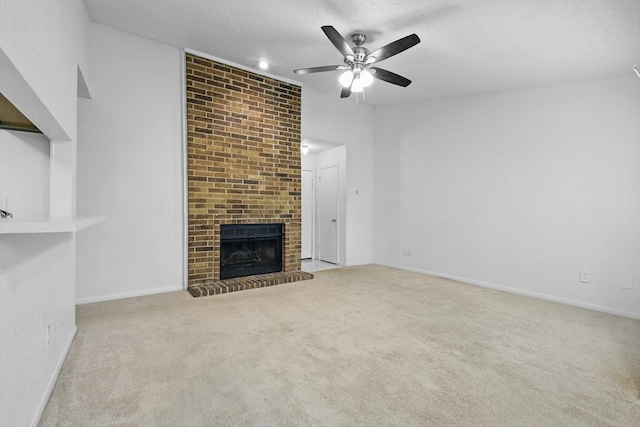 2000 Willoughby Ln Unit 5520, Arlington, TX 76011 - unfurnished living room with a ceiling fan, carpet, a textured ceiling, a fireplace, and baseboards