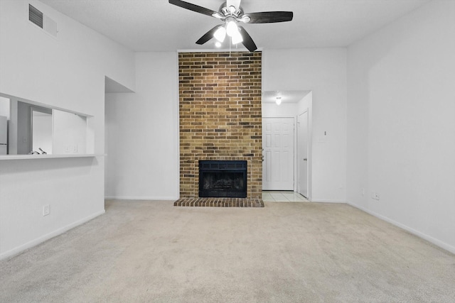2000 Willoughby Ln Unit 5520, Arlington, TX 76011 - unfurnished living room featuring carpet floors, a ceiling fan, a brick fireplace, and baseboards