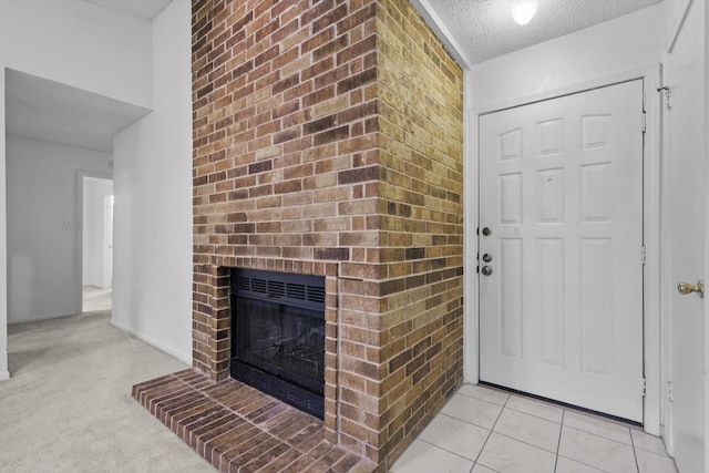 2000 Willoughby Ln Unit 5520, Arlington, TX 76011 - unfurnished living room featuring a textured ceiling and a fireplace