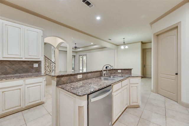 2137 Langdon Dr, Frisco, TX 75033 - kitchen with stainless steel dishwasher, a sink, decorative backsplash, light tile patterned flooring, and recessed lighting