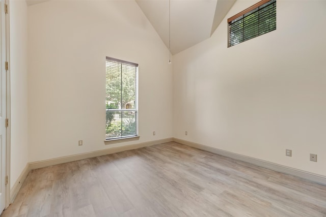 2137 Langdon Dr, Frisco, TX 75033 - spare room with light wood-type flooring, high vaulted ceiling, and baseboards