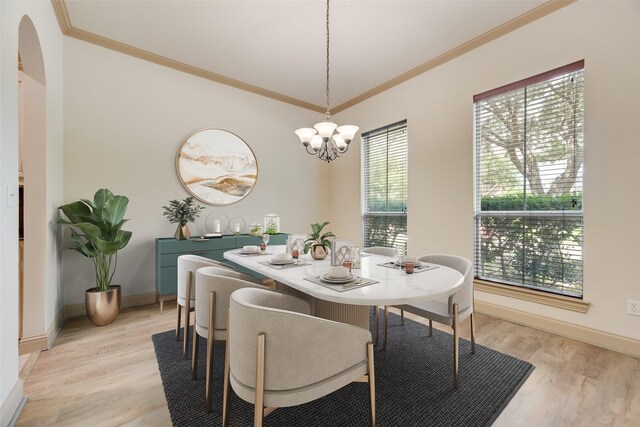 2137 Langdon Dr, Frisco, TX 75033 - dining area featuring plenty of natural light, crown molding, light wood-style floors, a chandelier, and baseboards