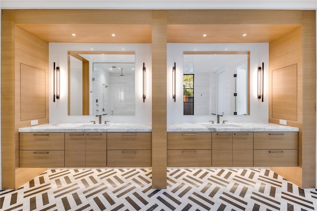 full bathroom with a shower stall and two vanities