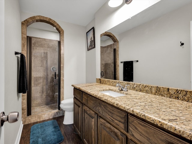 624 Hallvale Dr, White Settlement, TX 76108 - full bath featuring toilet, vanity, wood finished floors, and a shower stall