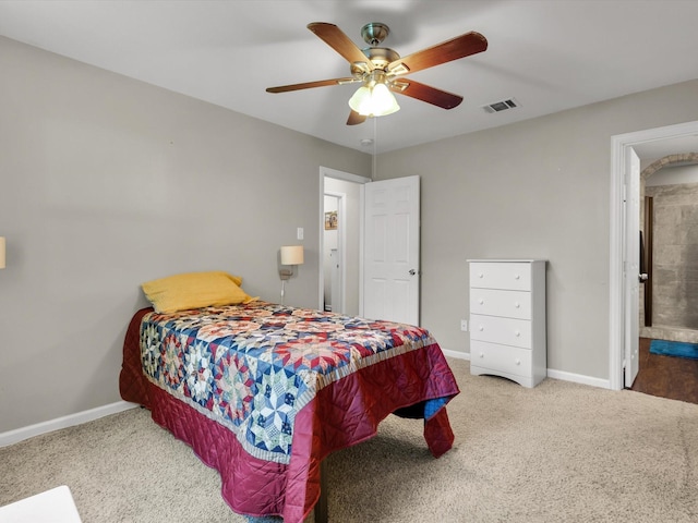 carpeted bedroom with baseboards and a ceiling fan