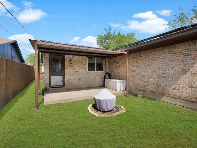 rear view of property with a patio area and brick siding