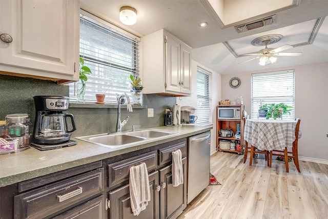 814 Branding Iron Trl, Granbury, TX 76049 - kitchen with stainless steel appliances, a sink, light wood-style floors, and white cabinetry