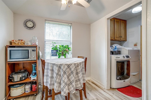 814 Branding Iron Trl, Granbury, TX 76049 - dining area featuring independent washer and dryer, a ceiling fan, light wood finished floors, and baseboards