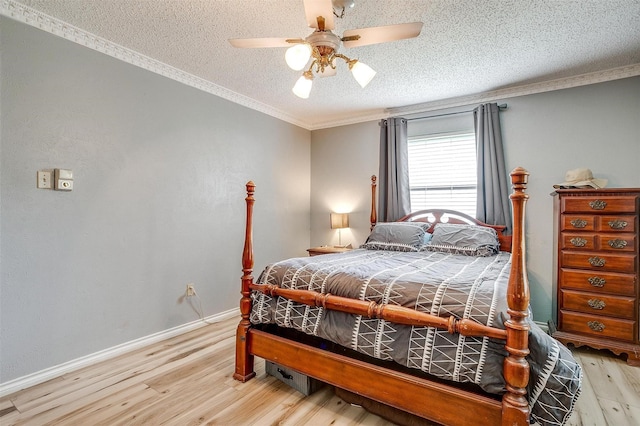 814 Branding Iron Trl, Granbury, TX 76049 - bedroom with wood finished floors, a textured ceiling, crown molding, ceiling fan, and baseboards