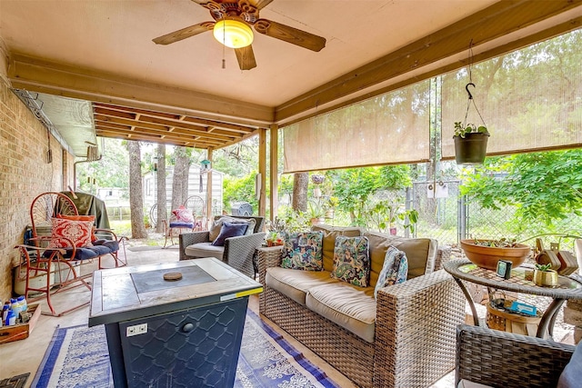 814 Branding Iron Trl, Granbury, TX 76049 - sunroom featuring an outdoor living space with a fire pit and a ceiling fan
