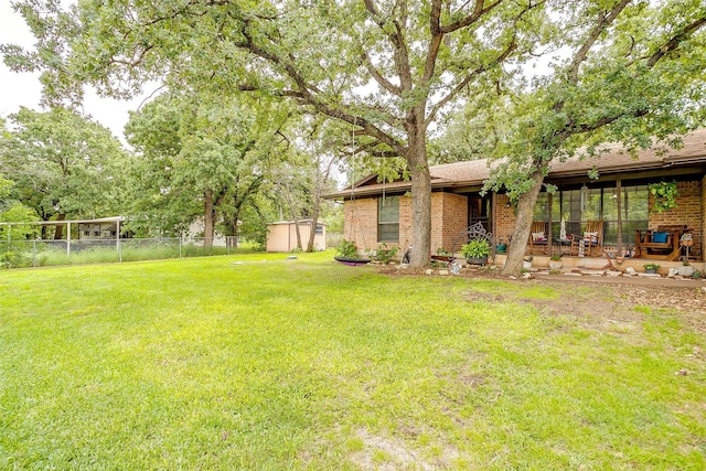 814 Branding Iron Trl, Granbury, TX 76049 - view of yard featuring a storage shed, an outdoor structure, and a patio