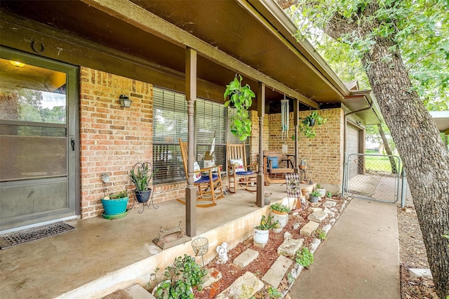 814 Branding Iron Trl, Granbury, TX 76049 - view of patio with covered porch and a gate