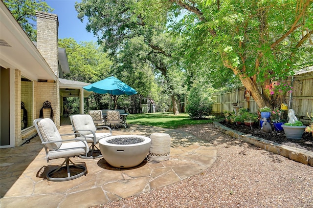 1010 Kings Canyon Ct, Grapevine, TX 76051 - view of patio / terrace with a fenced backyard and a fire pit
