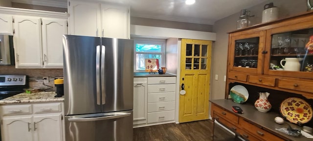 1010 Kings Canyon Ct, Grapevine, TX 76051 - kitchen featuring stainless steel appliances, white cabinetry, dark wood-style flooring, and ornamental molding