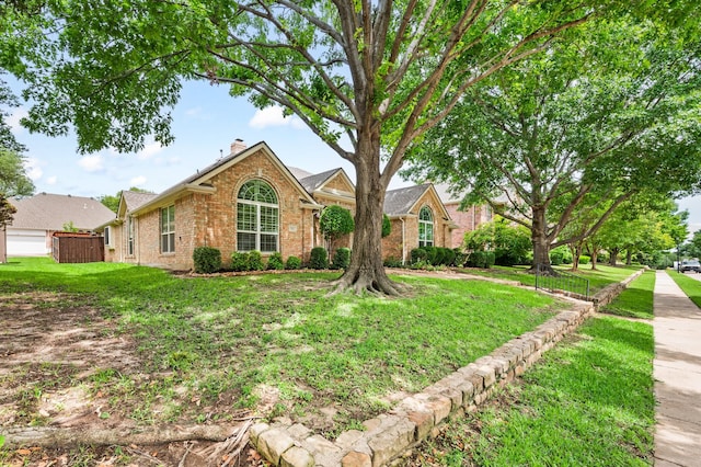 904 Blue Jay Ln, Coppell, TX 75019 - view of front of house featuring brick siding and a chimney