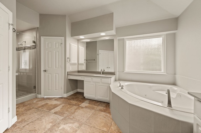 904 Blue Jay Ln, Coppell, TX 75019 - bathroom featuring a shower stall, a whirlpool tub, vanity, and baseboards