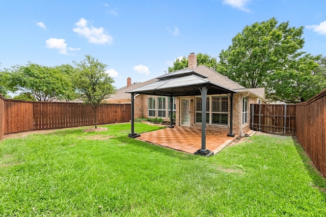 904 Blue Jay Ln, Coppell, TX 75019 - rear view of property featuring a gazebo, a patio, brick siding, roof with shingles, and a chimney