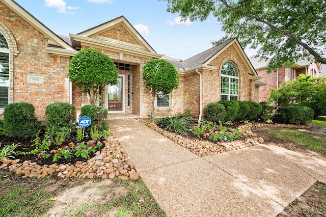 904 Blue Jay Ln, Coppell, TX 75019 - view of front of house featuring brick siding and roof with shingles