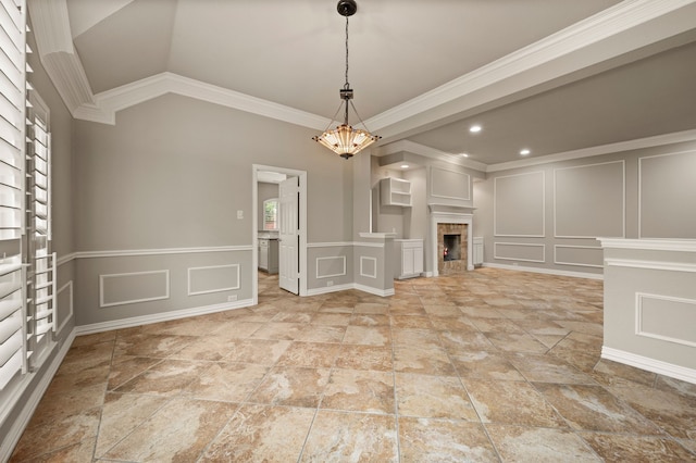 904 Blue Jay Ln, Coppell, TX 75019 - unfurnished dining area featuring a decorative wall, a chandelier, crown molding, a fireplace, and recessed lighting