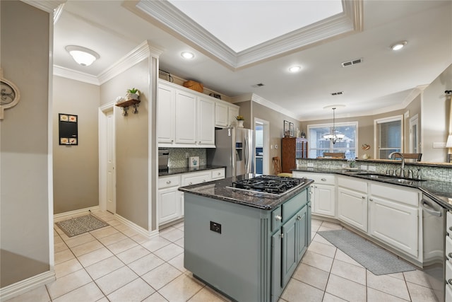 4019 Brooks Ct, Highland Village, TX 76226 - kitchen featuring a sink, stainless steel appliances, crown molding, white cabinets, and tasteful backsplash
