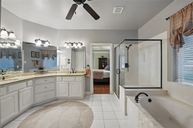 4019 Brooks Ct, Highland Village, TX 76226 - ensuite bathroom featuring tile patterned floors, a stall shower, double vanity, ceiling fan, and a bath