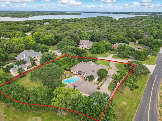 4019 Brooks Ct, Highland Village, TX 76226 - view of property location with property boundaries highlighted, a nearby body of water, a pool, and a heavily wooded area
