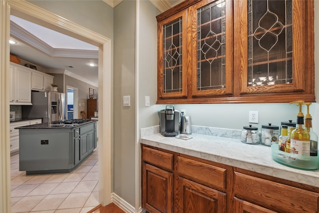 4019 Brooks Ct, Highland Village, TX 76226 - bar area with stainless steel appliances, ornamental molding, and light tile patterned flooring