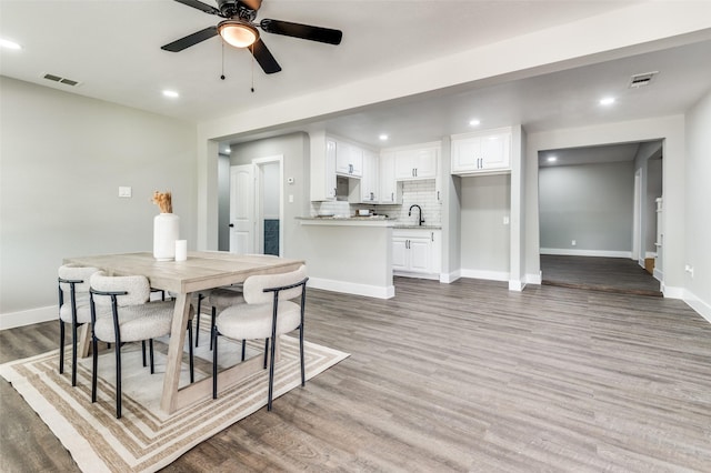 437 22nd St, Grand Prairie, TX 75050 - dining room featuring a ceiling fan, recessed lighting, baseboards, and wood finished floors