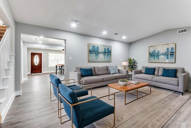 437 22nd St, Grand Prairie, TX 75050 - living area featuring light wood-style floors, baseboards, stairway, lofted ceiling, and recessed lighting