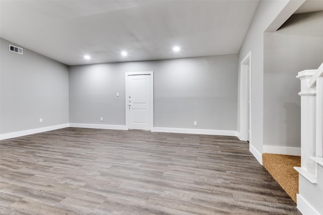 437 22nd St, Grand Prairie, TX 75050 - unfurnished living room with recessed lighting, baseboards, and wood finished floors