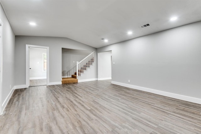 437 22nd St, Grand Prairie, TX 75050 - unfurnished living room featuring stairway, wood finished floors, vaulted ceiling, recessed lighting, and baseboards