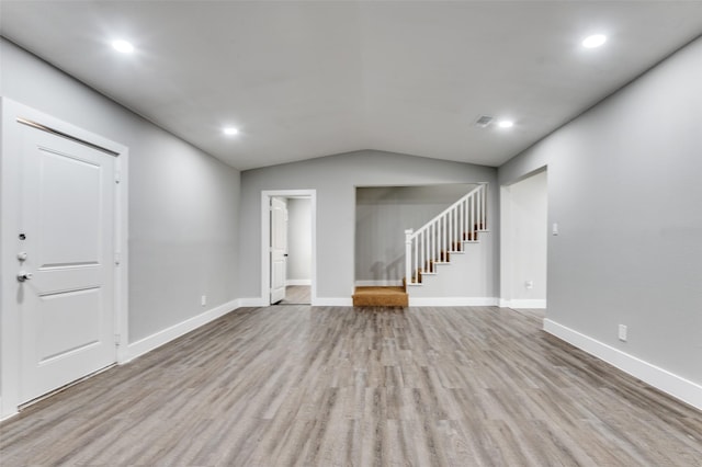 437 22nd St, Grand Prairie, TX 75050 - unfurnished living room featuring stairway, wood finished floors, lofted ceiling, baseboards, and recessed lighting