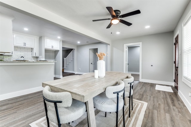 437 22nd St, Grand Prairie, TX 75050 - dining space with stairway, light wood finished floors, a ceiling fan, baseboards, and recessed lighting