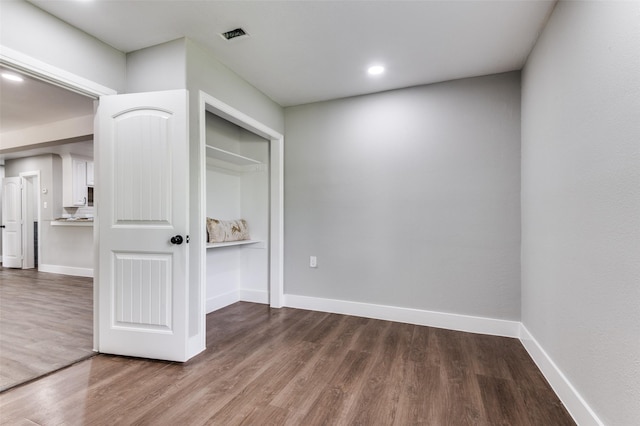 437 22nd St, Grand Prairie, TX 75050 - unfurnished room with wood finished floors, baseboards, and recessed lighting