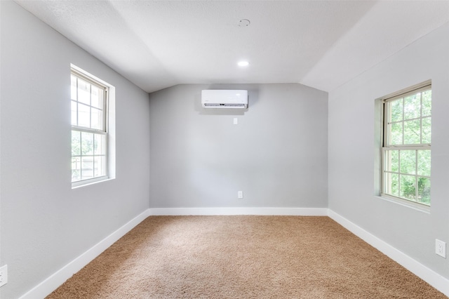 437 22nd St, Grand Prairie, TX 75050 - bonus room with a wall mounted air conditioner, lofted ceiling, carpet, and baseboards
