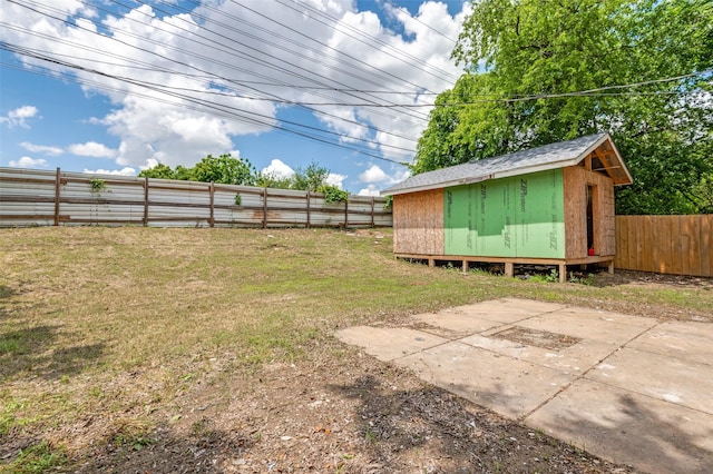 437 22nd St, Grand Prairie, TX 75050 - view of yard with a storage unit, an outbuilding, and a patio
