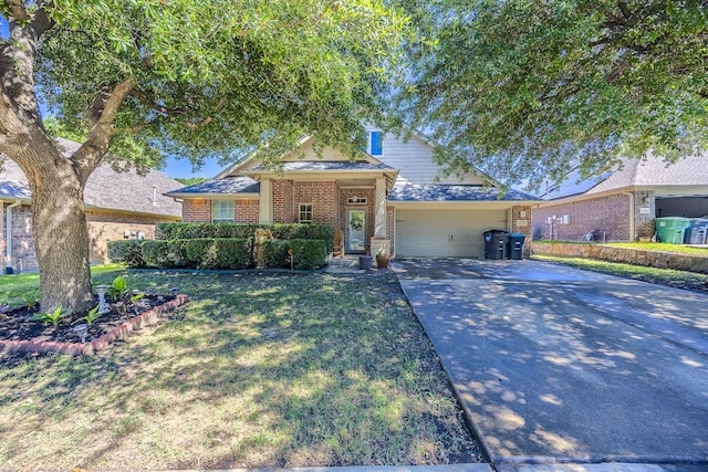 traditional-style home featuring brick siding, concrete driveway, a garage, and a front yard