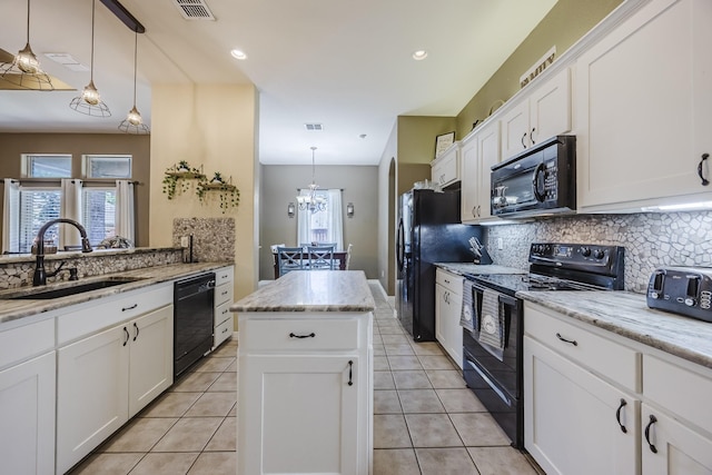 kitchen featuring black appliances, a sink, backsplash, white cabinetry, and light tile patterned floors