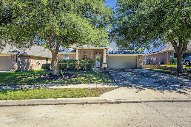 view of front facade with brick siding, an attached garage, concrete driveway, and a front lawn