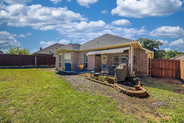 back of house featuring a patio and brick siding