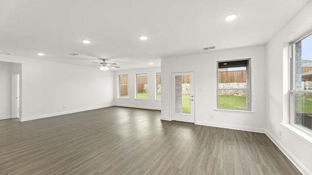 1906 Bobbin Ml, Forney, TX 75126 - unfurnished living room with plenty of natural light, baseboards, recessed lighting, and dark wood finished floors