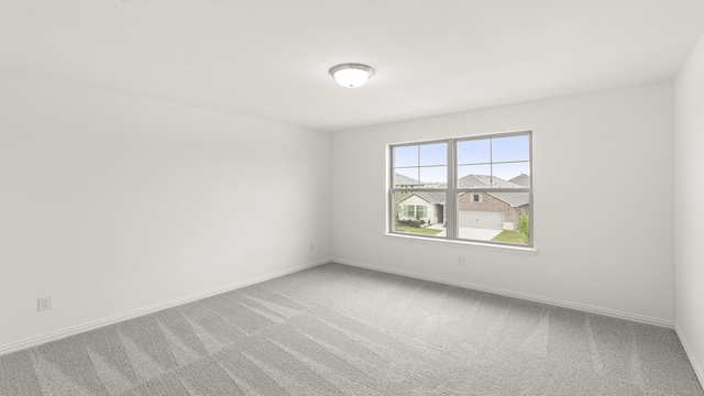1906 Bobbin Ml, Forney, TX 75126 - spare room featuring carpet and baseboards