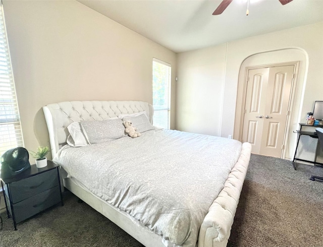carpeted bedroom featuring a ceiling fan