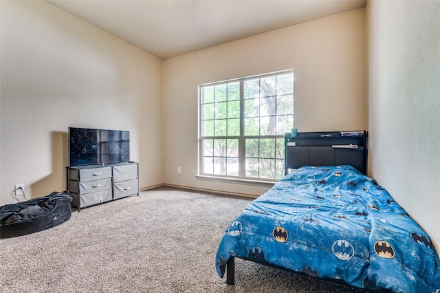 bedroom with carpet and baseboards