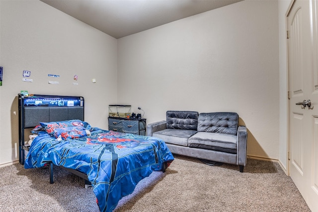 carpeted bedroom featuring baseboards