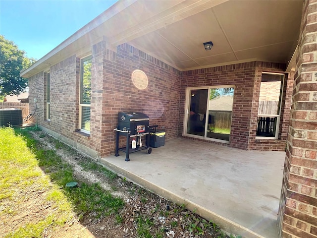 view of patio with central AC unit and grilling area